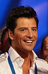 https://upload.wikimedia.org/wikipedia/commons/thumb/5/5a/Sakis_Rouvas_in_Moscow.jpg/100px-Sakis_Rouvas_in_Moscow.jpg